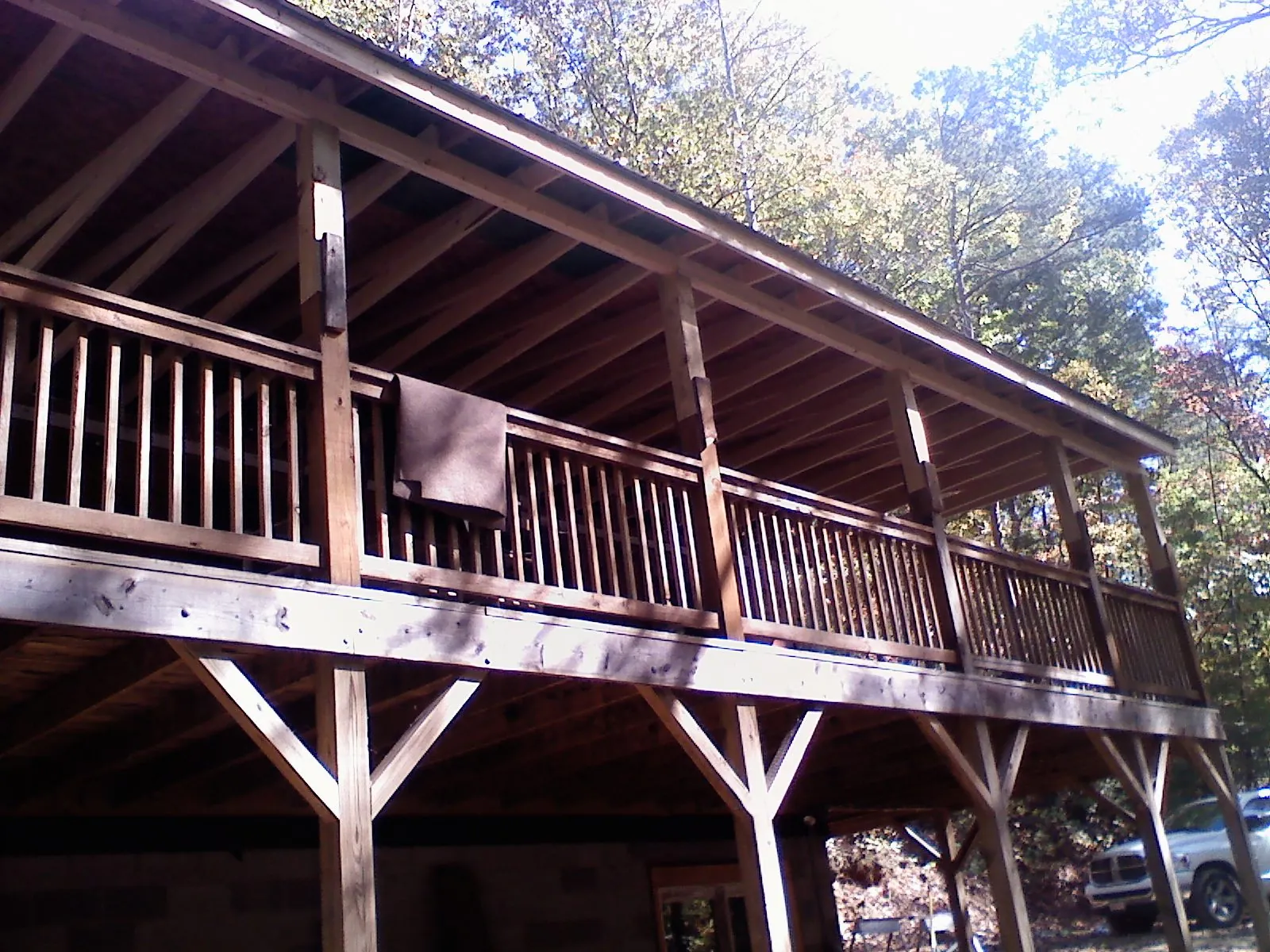 Timber framing under a new elevated porch and deck — Roof Leak Repair in King by Roofing Brothers